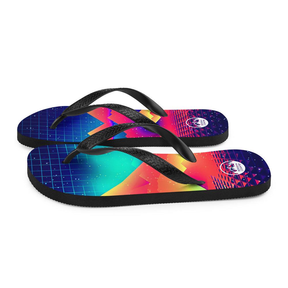 Colorful Techno-Synth Rave Flip-Flops with black Y-shaped rubber straps and a vibrant geometric design.