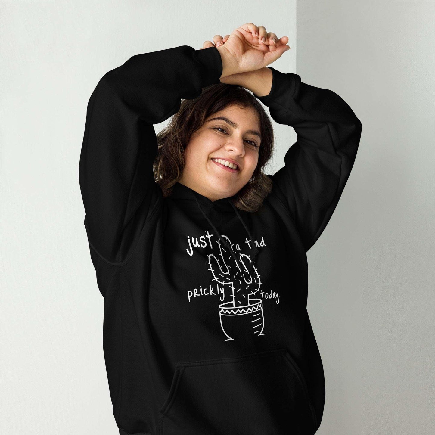 Unisex hoodie with prickly cactus design, representing introverts' love for nature.