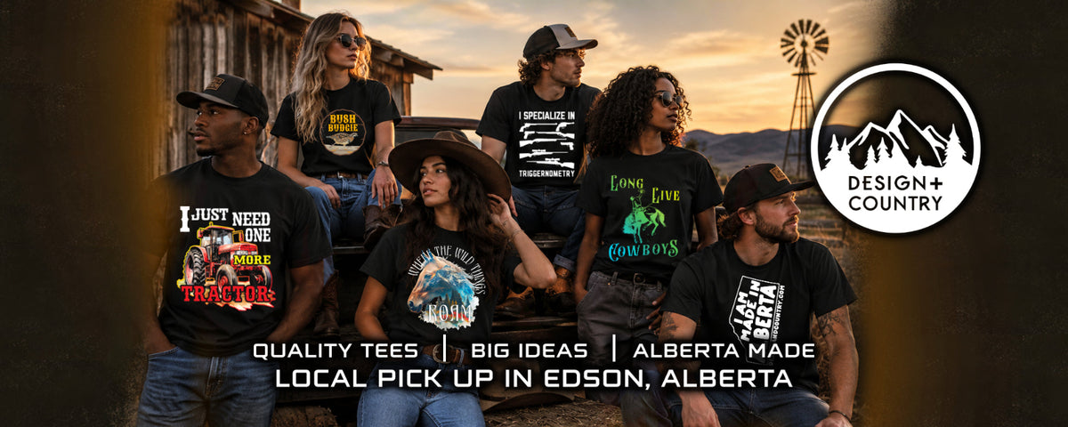 A group of seven people wearing black graphic t-shirts in an outdoor setting with a rustic wooden building and a windmill in the background. The shirts feature various designs and text, including 'I JUST NEED ONE MORE PIZZA PIZZA PIZZA' and 'Love Lake Backroads'.