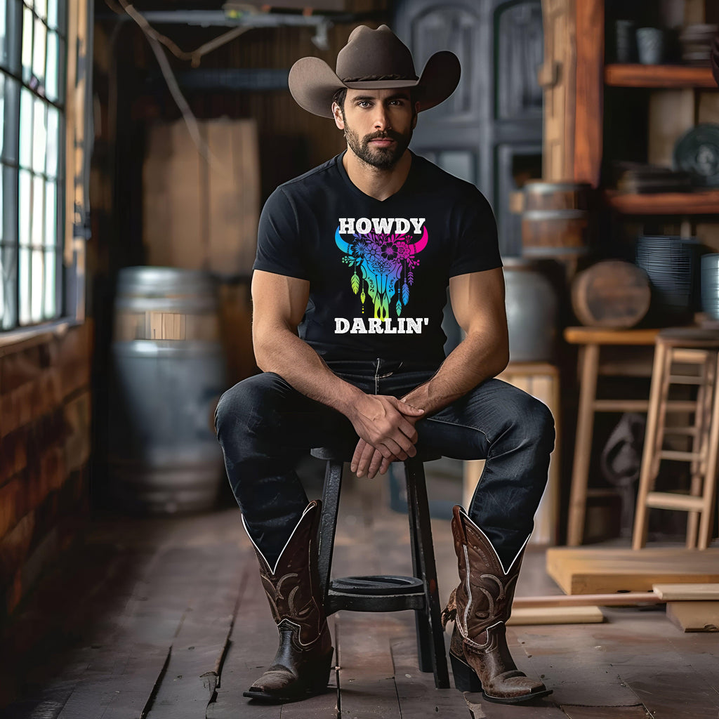 Cowboy wearing Howdy Darlin' Cowboy Tee, vibrant design, in rustic setting.