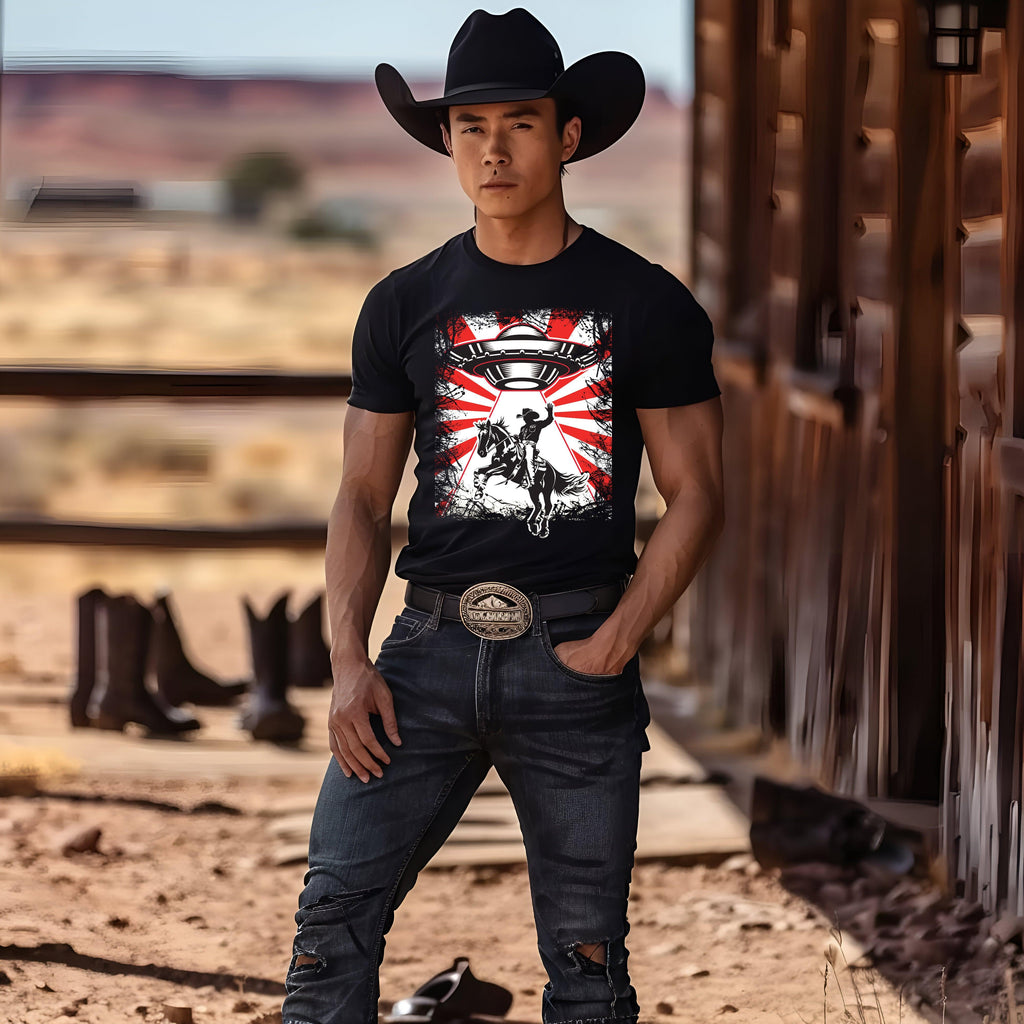 UFO Cowboy Abduction Unisex Tee worn by person in cowboy attire, graphic print showcased, outdoor setting.