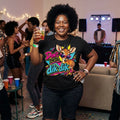 Woman wearing a black Don't Be a Dik-Dik graphic T-shirt with a colourful cartoon dik-dik antelope